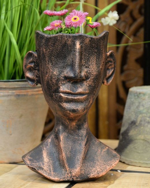‘The Watcher’ Contemporary Tribal Planter in Cast Aluminium Large with flowers main image ‘The Watcher’ Contemporary Tribal Planter in Cast Aluminium Large with flowers main image