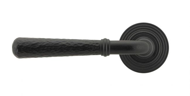 Matte Black Hammered Lever Door Handle on Beehive Rose Front