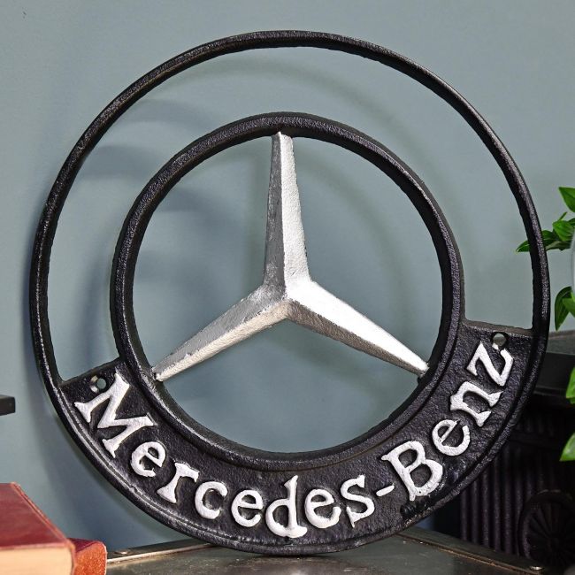 "Mercedes" Automobilia Reproduction Sign in Situ Next to a Blue Wall "Mercedes" Automobilia Reproduction Sign in Situ Next to a Blue Wall