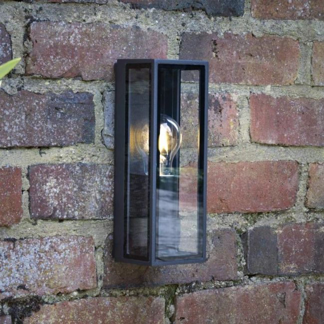 Modern Simplistic Squared Wall Light in Situ on a Brick Wall Modern Simplistic Squared Wall Light in Situ on a Brick Wall