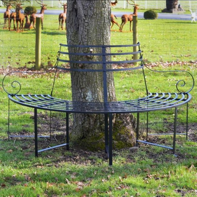 "Monmouthshire" Wrought Iron Deluxe Tree Seat in Situ by a Tree "Monmouthshire" Wrought Iron Deluxe Tree Seat in Situ by a Tree