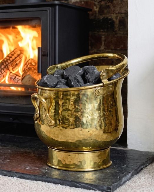 Polished Brass Coal Bucket holding Coal By the Fireplace