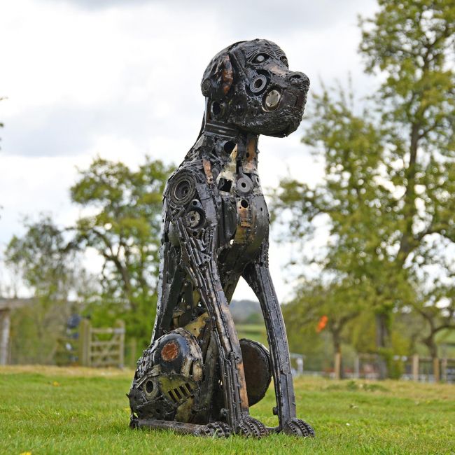 Recycled Parts Dog Sculpture in Situ in the Garden