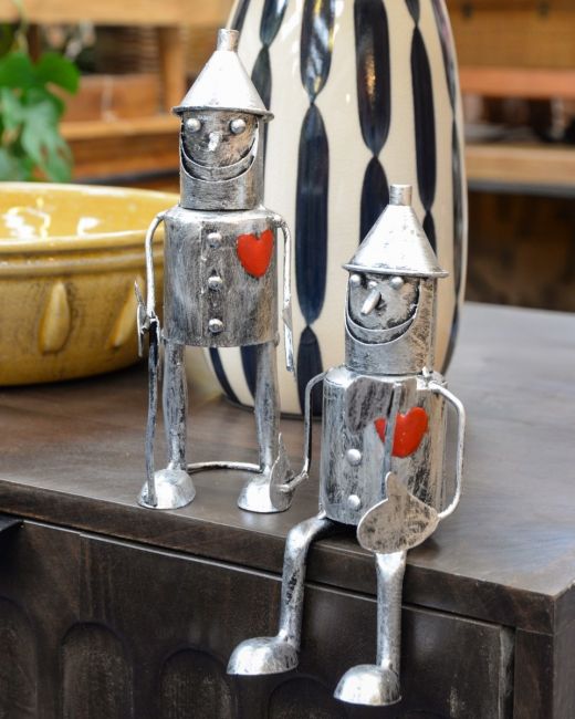 Set of Two Sitting & Standing "Rusty" Tin Men Garden Ornaments Positioned on a Table