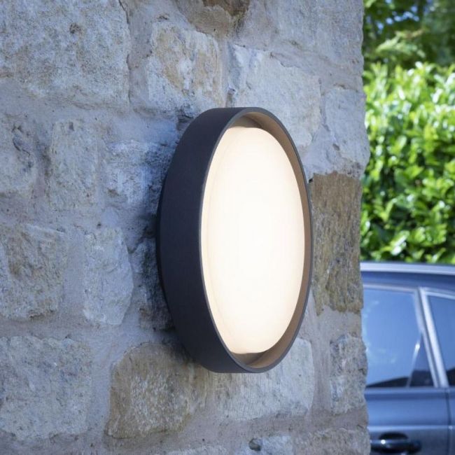 Round Wall Light in a Anthracite Finish in Situ on a Stone Wall Round Wall Light in a Anthracite Finish in Situ on a Stone Wall
