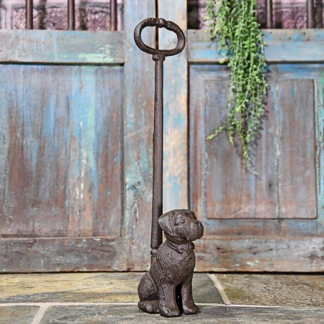 Cast Iron Dog Door Stop in Situ by a Rustic Door Cast Iron Dog Door Stop in Situ by a Rustic Door