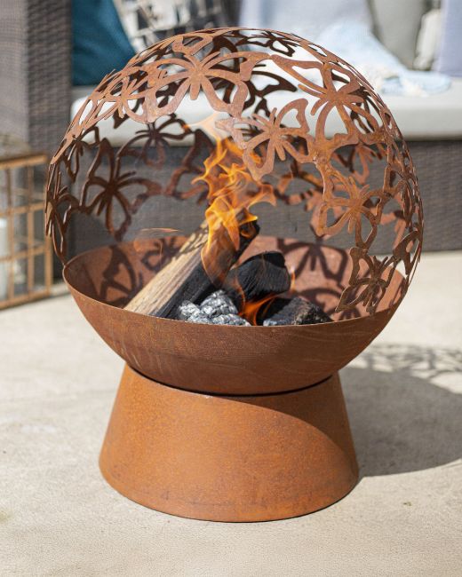 Rustic Globe Fire Pit with a Butterfly Design in Situ Outdoors Rustic Globe Fire Pit with a Butterfly Design in Situ Outdoors