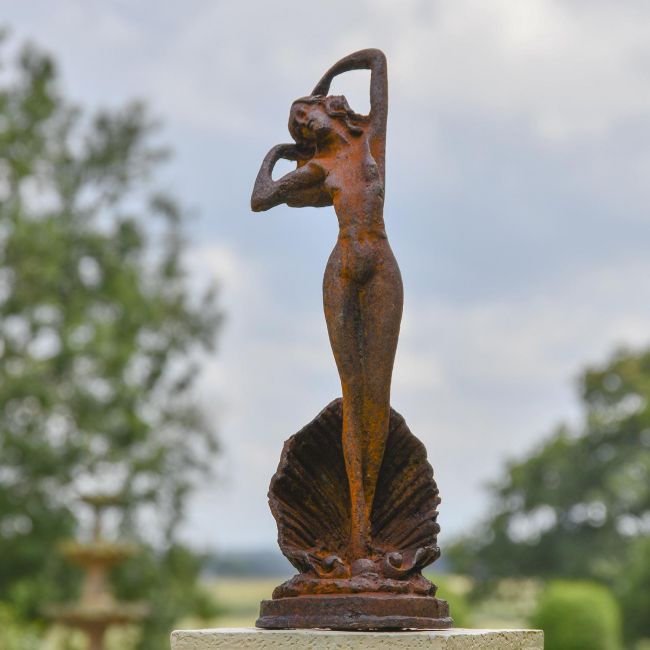 Lady Standing on Clam Sculpture in Situ in the Garden