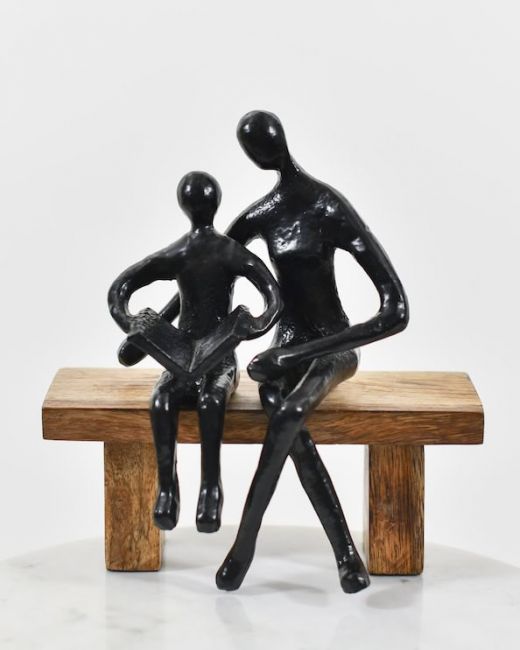 Shared pages cast aluminium and mango wood sculpture