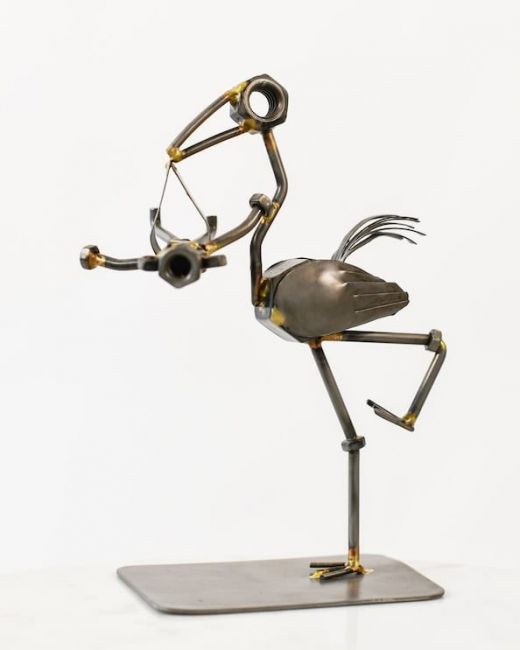 Recycled Metal Stork with Baby Sculpture Recycled Metal Stork with Baby Sculpture