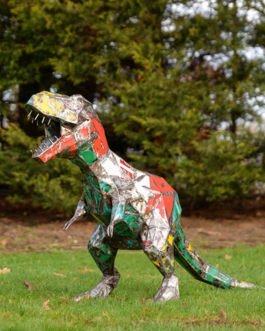 ‘Byte’ the T. Rex Upcycled Oil Drum Garden Sculpture stood on lawn main image