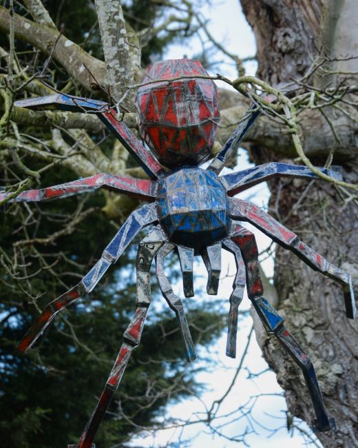 Tarantula Upcycled Oil Drum Garden Sculpture main image hanging from a tree Tarantula Upcycled Oil Drum Garden Sculpture main image hanging from a tree