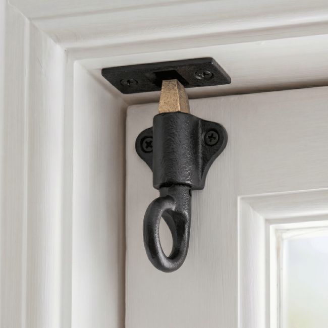 Th "Tolvthan" Iron Fanlight Catch Fitted on a White Door and Door Frame - Digital Illustration 