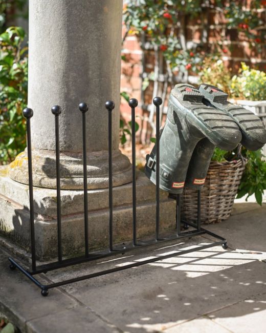 The 4-Pair Welly Boot Rack Stand Shown with a Pair of Wellington Boots on them