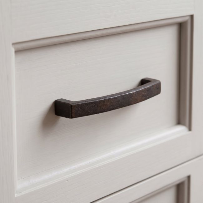 The 5.5" Linear Bridge Pull Handle in Beeswax Stood Upright on a White Background