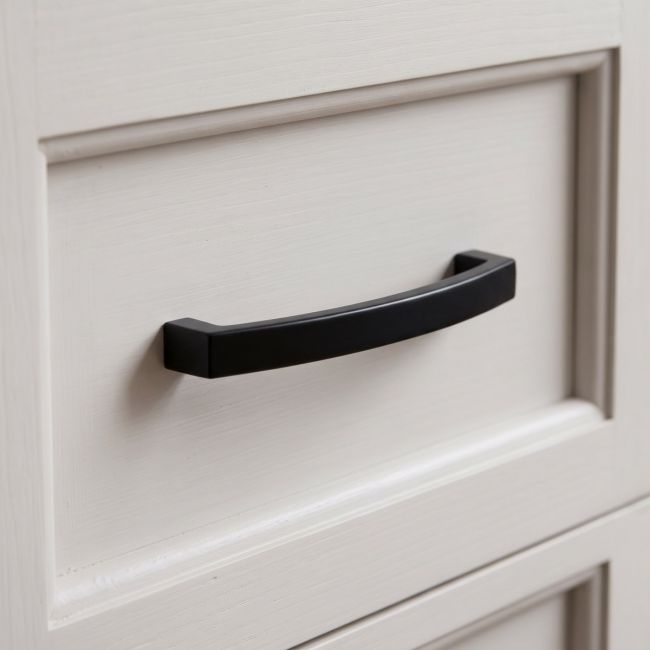 The 5.5" Linear Bridge Pull Handle in Black Stood Upright on a White Background