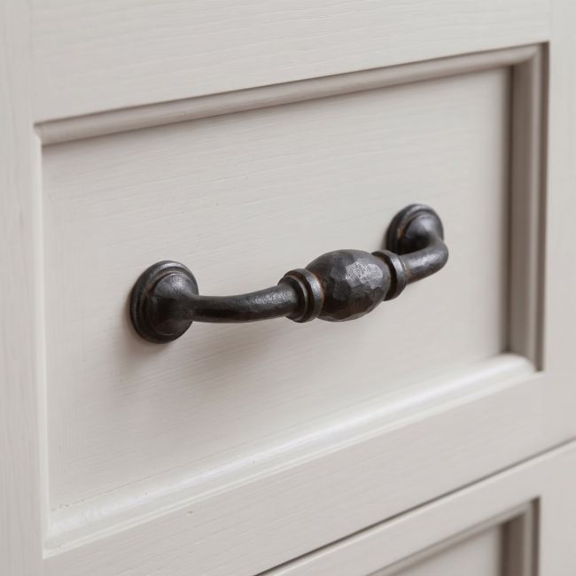 The 5" Hand-Hammered D Pull Handle in Beeswax Shown Upright on a White Background