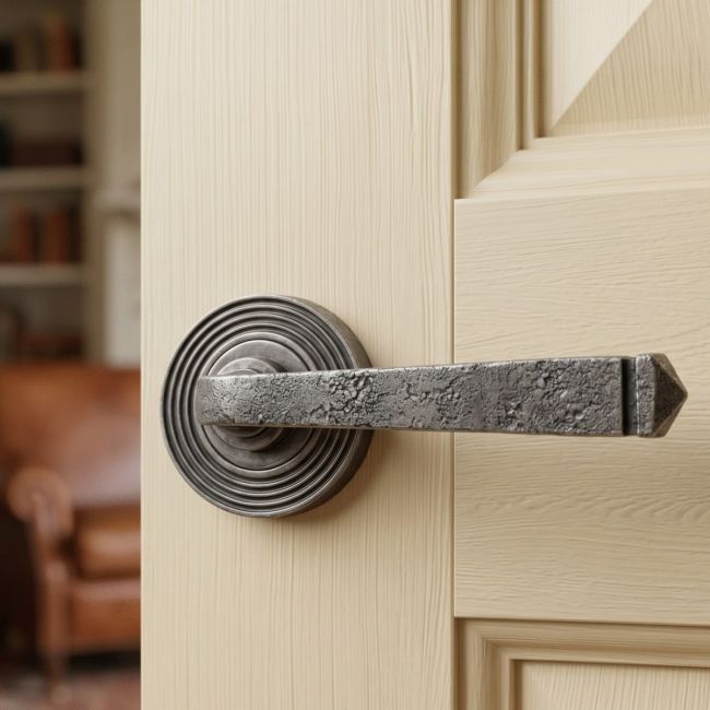 Aged Pewter Unsprung Lever Door Handle on Beehive Rose Front