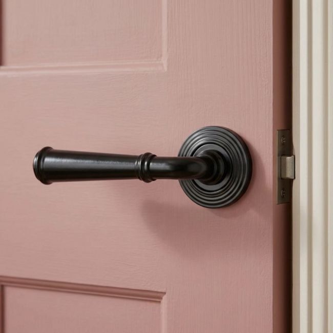 Midnight Black Unsprung Lever Door Handle on Beehive Rose Front