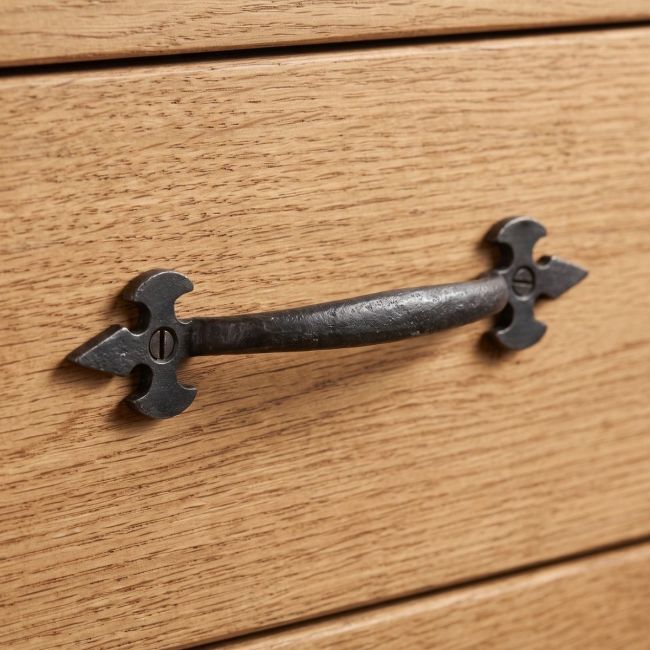 The Gothic Fleur-de-Lis Bow Handle - 157mm Shown on a Traditional Wooden Drawer - Digital Illustration