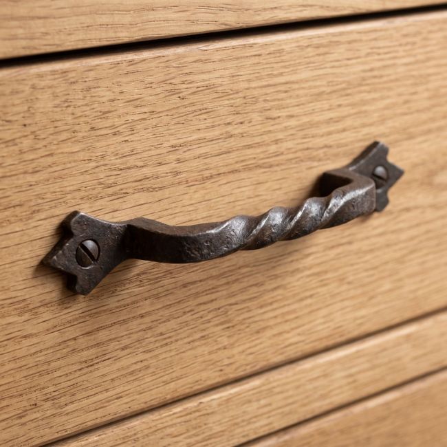 The Gothic Twisted Barley Cast Iron Pull Handle - 145mm Shown on a Wooden Drawer - Digital Illustration