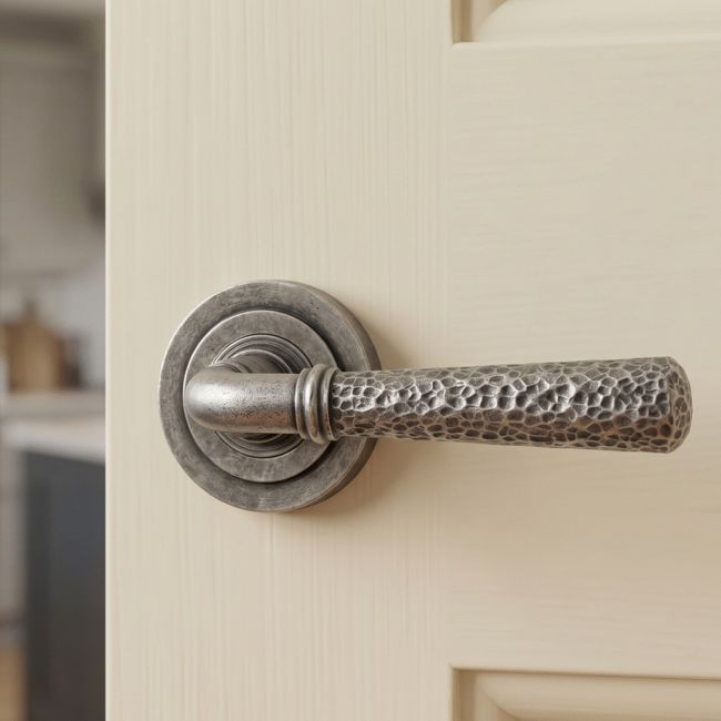 Aged Pewter Hammered Unsprung Lever Door Handle on Art Deco Rose Front