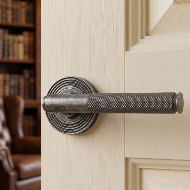Aged Pewter Textured Unsprung Lever Door Handle on Beehive Rose Front