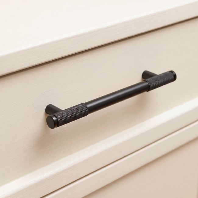The Medium Half Knurled Cabinet Pull Handle in Aged Bronze Shown Upright on a White Background
