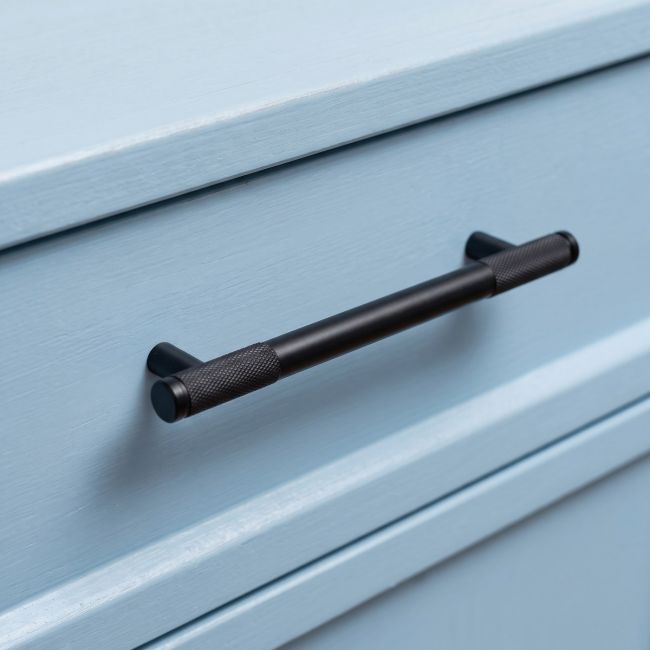The Medium Half Knurled Cabinet Pull Handle in Matt Black Shown Upright on a White Background