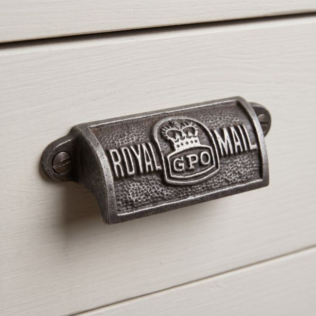 The Royal Mail GPO Cast Antique Iron Cup Pull Handle - 4" Shown on a Grey Set of Drawers - Digital Illustration