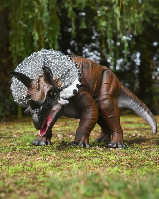 The Sentinel the Triceratops Garden Sculpture Shown a Garden Lawn