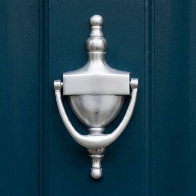 Silver Finish Urn Style Door Knocker on a Black Door