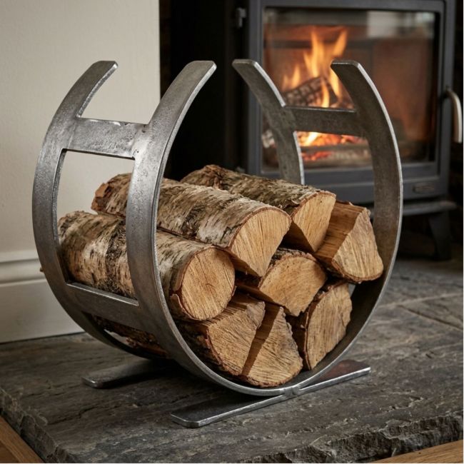 The Small Curved Fireside Log Holder in Pewter Shown from an Angle on a White Background
