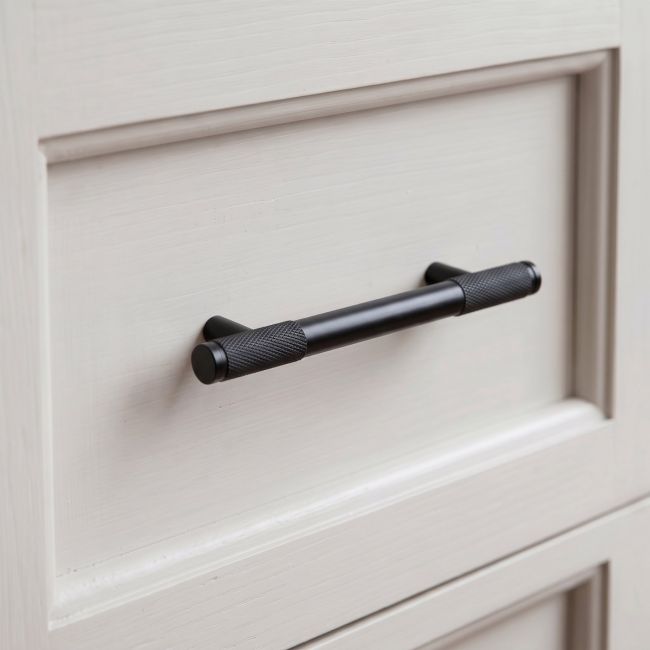 The Small Half Knurled Cabinet Pull Handle in Matt Black Shown Upright on a White Background
