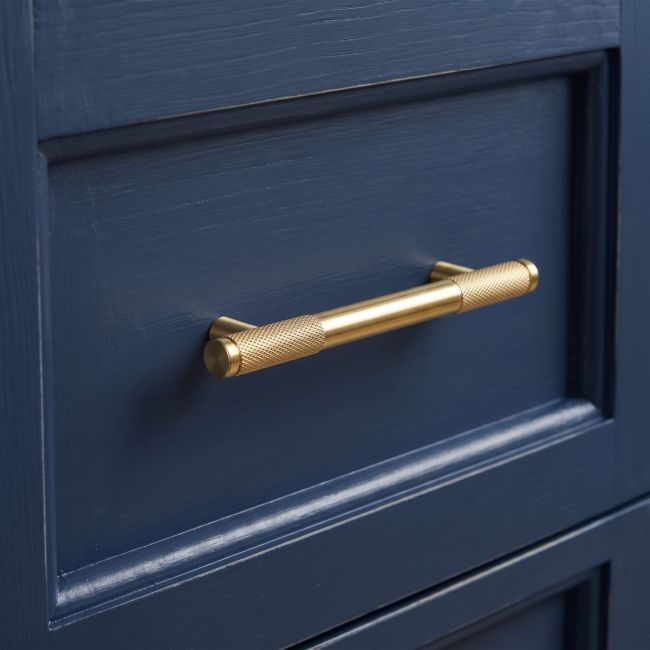 The Small Half Knurled Cabinet Pull Handle in Polished Brass Shown Upright on a White Background