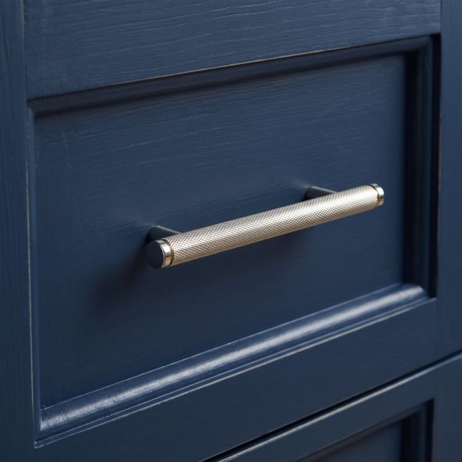 The Small Knurled Cabinet Pull Handle in Polished Nickel Shown Upright on a White Background