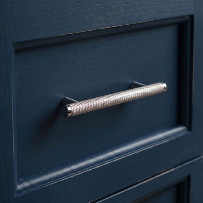 The Small Knurled Cabinet Pull Handle in Polished Stainless Steel Shown Upright on a White Background