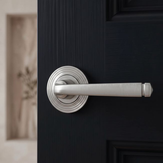 The Valen Tapered Sprung Handle Set on a Beehive Rose in Satin Stainless Steel Shown at an Angle on a White Background