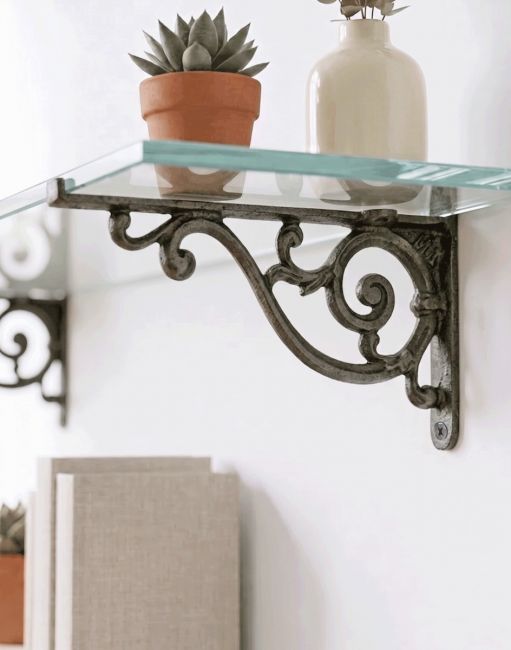 The 12 x 21cm "Luciano" Ornate Scroll Bracket Mounted on a White Coloured Wall Supporting a Glass shelf - Digital Illustration