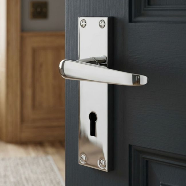 The Polished Chrome Victorian Straight Lock Door Handles - 150mm Keyhole Lever Pair on a White Background