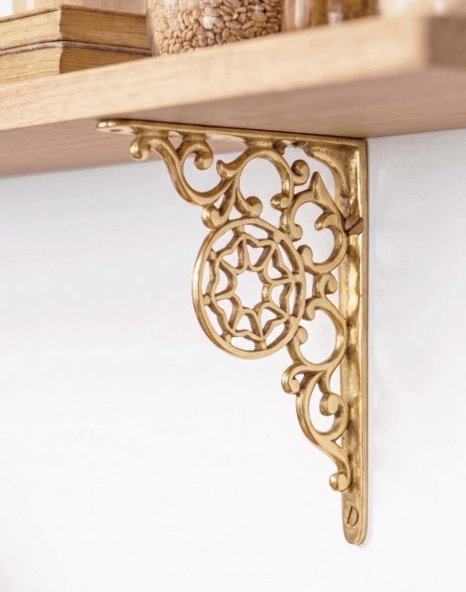 The 17 x 13cm “Harrison” Brass Wall Bracket Mounted on a White Contemporary Living Room Wall - Digital Illustration 