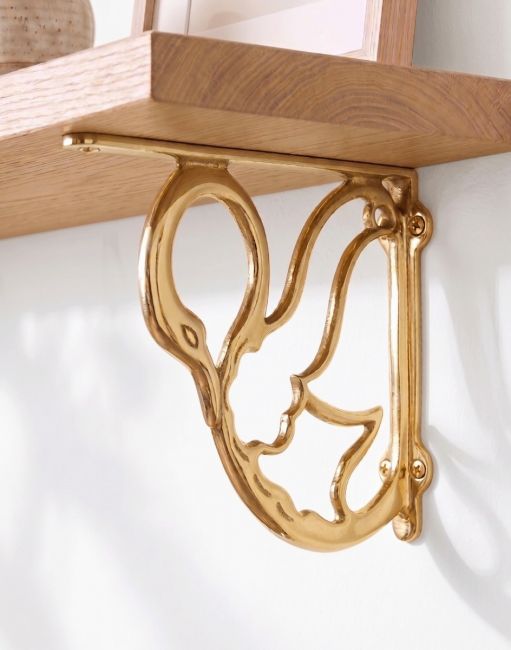 The 17cm x 20cm "Coscoroba" Polished Brass Swan Bracket Mounted on a Contemporary Living Room Wall - Digital Illustration 