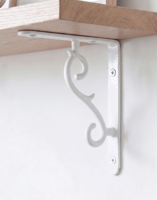 The 18 x 14.5cm White Scroll Effect Wall Bracket Fixed to a Wooden DIY Shelf on a Modern Living Room Wall - Digital Illustration 