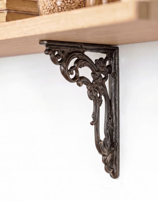 The 18 x 14cm Ornate Cast Iron "Victorian Amalina" Scroll Bracket Mounted on a Neutral Tone Modern Interior Wall - Digital Illustration 
