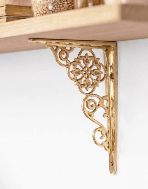 The 18cm x 13cm Ornate “Pittsburgh” Scroll Effect Brass Shelf Bracket Mounted on a Contemporary Living Room Wall - Digital Illustration 