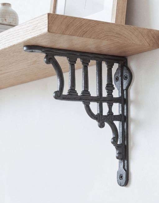 The 20 x 20cm Cast Iron Greek Column Shelf Bracket Mounted on a Contemporary Living Room Wall - Digital Illustration 