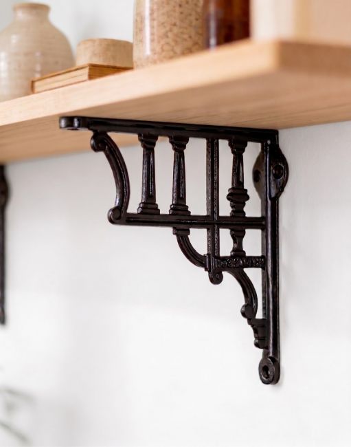 The 20 x 20cm "Edessa" Shelf Bracket Mounted on a Contemporary Living Room Wall - Digital Illustration 