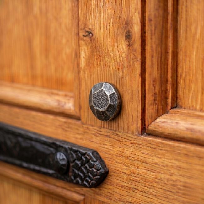 The 20mm Pewter Round Door Stud Nailed into a Heavy WoodenDoor - Digital Illustration 
