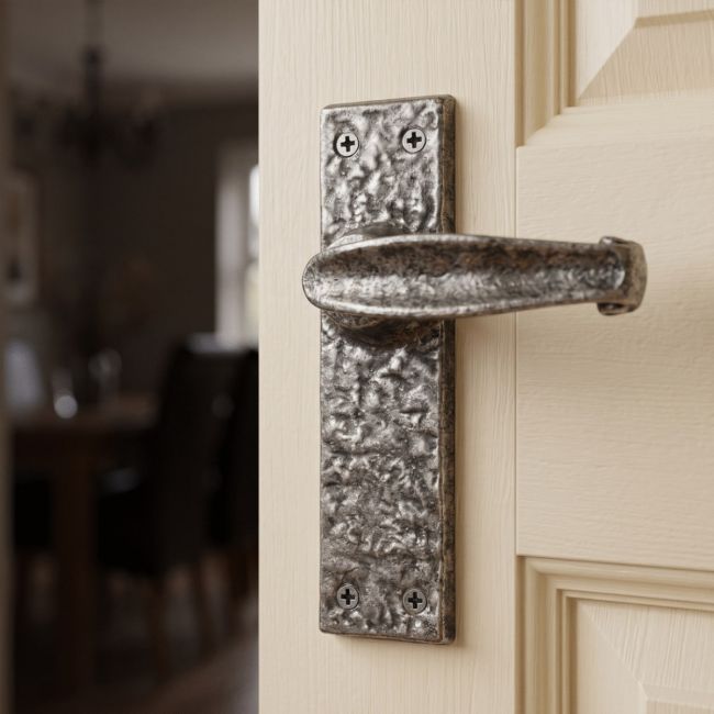 The "Acerno" Traditional Cast Iron Lever Handle on a Cream Coloured Door in a Traditional Home - Digital Illustration