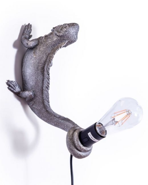 The "Arboreal Guardian" Iguana Wall Light in Silver Shown Mounted on a White Wall 
